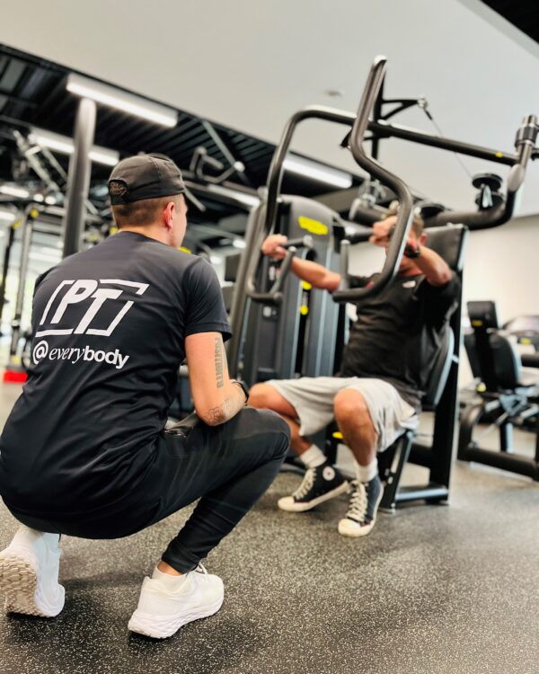 Personal trainer with client