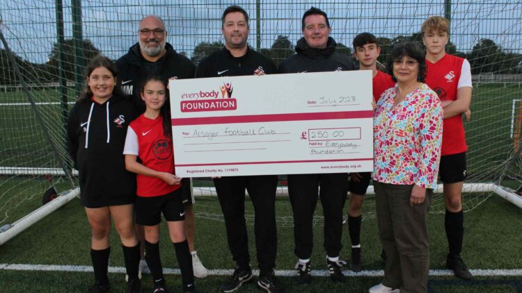 Everybody Foundation Trustee Kimiyo Rickett presenting Andrew Miller and AFC Alsager their grant from the Everybody Foundation