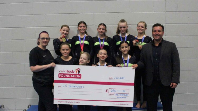 Thomas Barton Everybody Health & Leisure CEO presenting grant cheque to Candy Lakin & LS Gymnastics from the Everybody Foundation