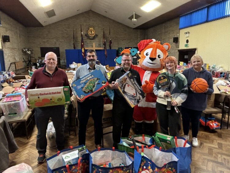 L-R:, John Perry Salvation Army volunteer, Richard Jones Area General Manager at Everybody, Paul Cartwright Assistant Manager at Everybody, Todd the Tiger Everybody Mascot, Hannah Whitley Grants and Funding Lead at Everybody & Heather Newton, Salvation Army Christmas Appeal Coordinator